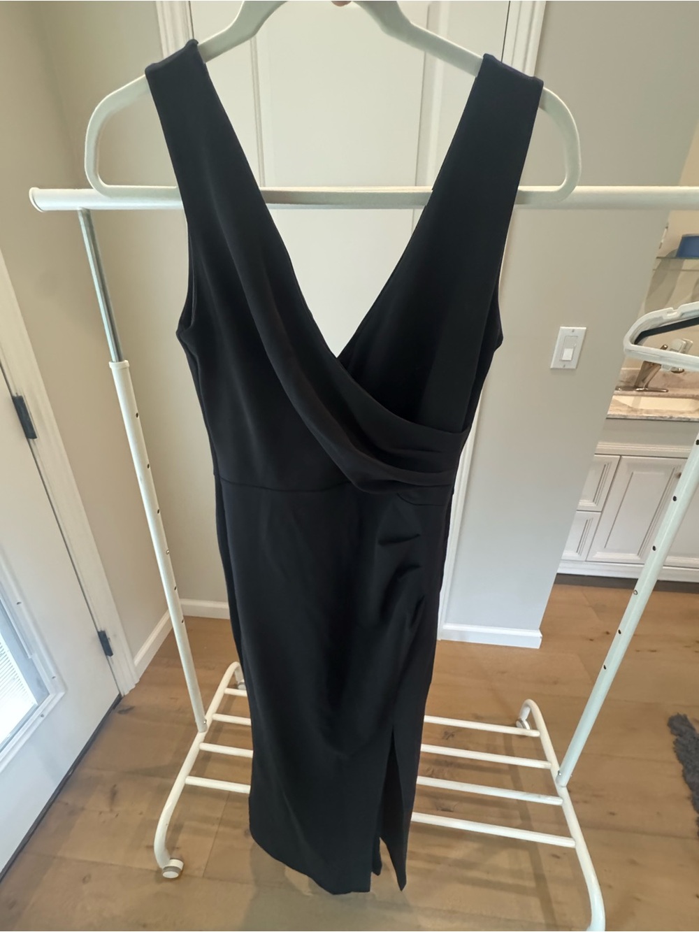 Sleek Black Sleeveless Midi Dress with Draped V-Neck